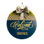 Welcome sign for front door porch made of MDF wood with acrylic paint vinyl lettering and artificial flowers